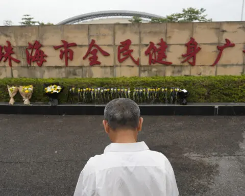 Driver rams his car into crowd in China, killing 35. Police say he was upset about his divorce