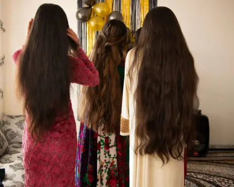 In this birthday party portrait, teenage girls celebrate in secret in Afghanistan