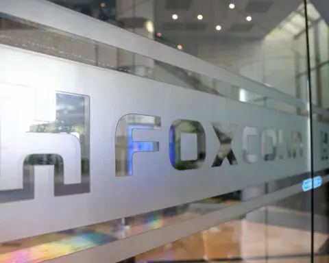 Foxconn sees robust AI server demand, delays EV target