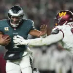 Saquon Barkley runs for 2 TDs, Eagles beat Commanders 26-18 to stretch NFC East lead