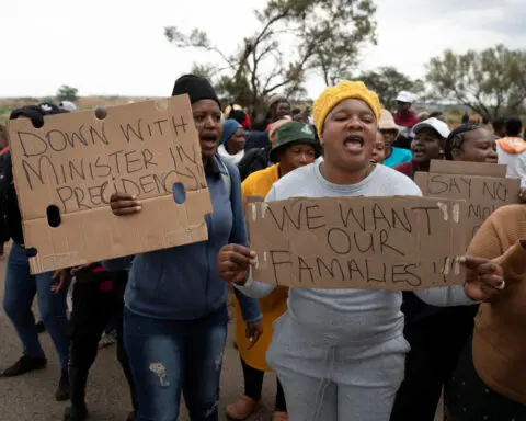 South African police in standoff with hundreds of illegal miners in disused shaft