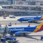 Passengers on parked Southwest plane forced to evacuate after cell phone, airplane seat catch fire