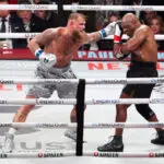 Boxing-Paul beats Tyson as former heavyweight champ can't turn back clock