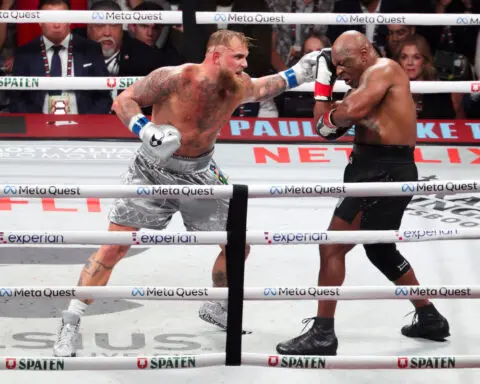 Boxing-Paul beats Tyson as former heavyweight champ can't turn back clock