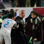 Mexico soccer manager Javier Aguirre struck by can thrown onto the pitch from stands, left with bloodied head