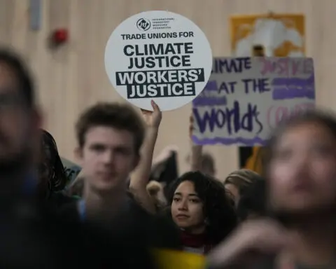 Protesters gather at UN climate talks in global day of action as progress on a deal slows