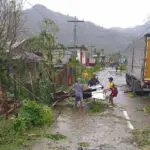 Latest typhoon batters the Philippines, causing tidal surges and displacing about 400,000 people