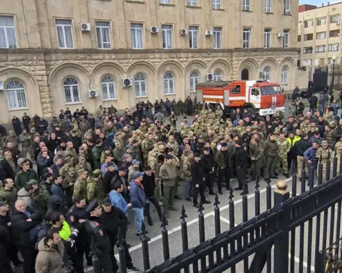 Protesters in separatist Georgian region occupy government buildings, calling for leader's ouster