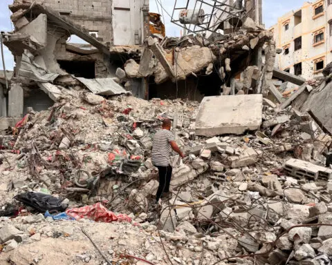 Desperate for cash, Gazans sell clothes plucked from rubble