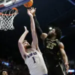 Kansas remains No. 1 in AP poll, top 10 shuffled with losses by 3 teams; Wisconsin joins rankings