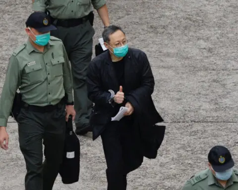 Hong Kong court sentences pro-democracy activist Benny Tai to 10 years in prison