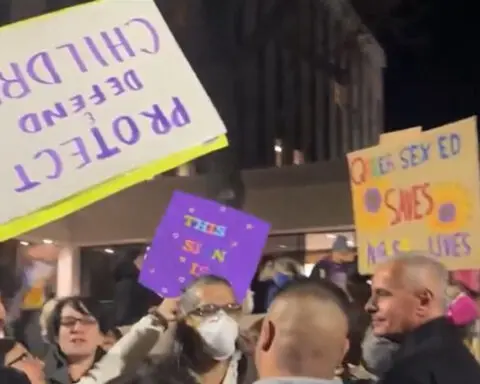 Protest erupts outside of APS board meeting as protestors seek book ban