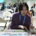 In a board game, climate experts work to save the world, which diplomats at COP29 try in real life