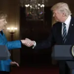 German ex-leader Merkel says she felt sorrow at Trump's comeback and recalls awkward non-handshake