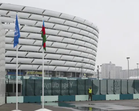 Negotiators work through the night at UN climate talks to try to reach a cash deal for poor nations