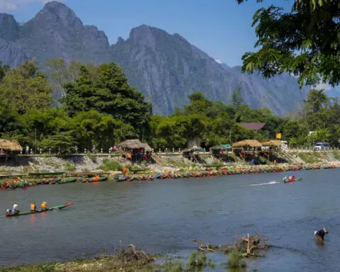 Laos government pledges justice in mass alcohol poisoning case that has killed 6 tourists