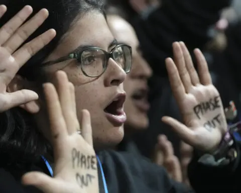 Negotiators work through the night at UN climate talks to try to reach a cash deal for poor nations