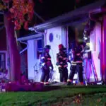 Officers rescue elderly woman from burning home