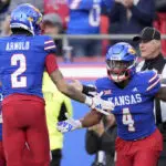 Devin Neal scores 4 times, Kansas beats No. 16 Colorado 37-21 as Buffs' Big 12 title hopes take hit