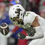 Devin Neal scores 4 times, Kansas beats No. 16 Colorado 37-21 as Buffs' Big 12 title hopes take hit