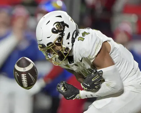 Devin Neal scores 4 times, Kansas beats No. 16 Colorado 37-21 as Buffs' Big 12 title hopes take hit