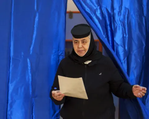 Romanians cast ballots in presidential race that could pit nationalist against leftist in a runoff