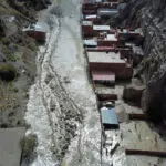 Bolivia's heavy rains cause river to flood homes near La Paz