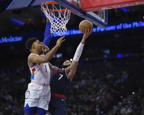 Injured Joel Embiid, Paul George watch from the 76ers' bench once again