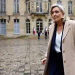 French far-right leader repeats threat to topple government after talks with PM Barnier