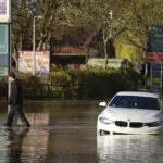 Hundreds of homeowners in England and Wales battle floodwaters after weekend storm