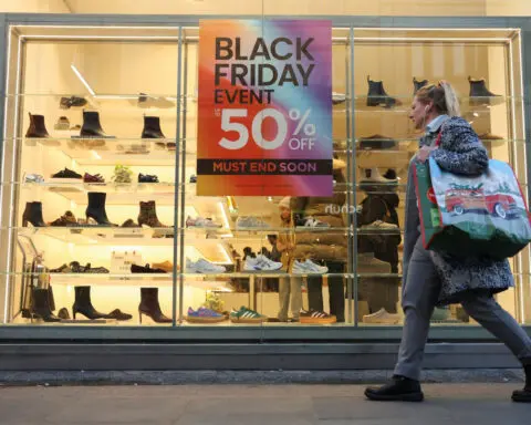 UK shop prices fall less sharply in November, survey shows