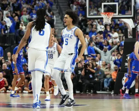 Kansas center Hunter Dickinson ejected for kicking Duke's Maliq Brown in the head