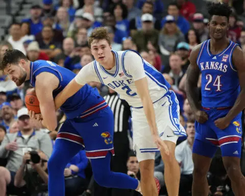 Kansas center Hunter Dickinson ejected for kicking Duke's Maliq Brown in the head