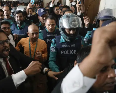 Bangladesh steps up security, arrests six for lawyer's killing amid protests