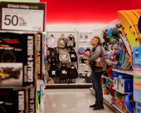 US Black Friday spending at stores inches ahead as Americans spend more online