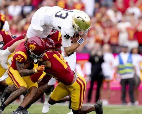 No. 5 Notre Dame punches CFP ticket with 2 late interception return TDs to beat USC 49-35