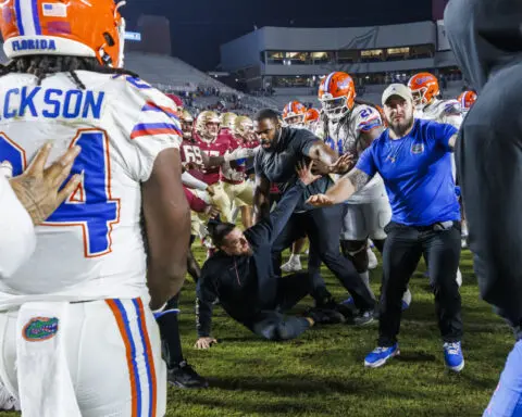 College football players scuffle after flags come out following rivalry wins