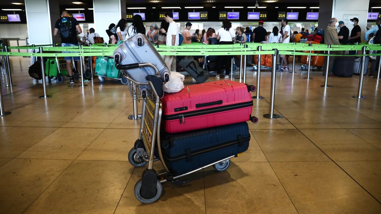 A cart of luggage is left unattended at Adolfo Suárez Madrid–Barajas Airport in Spain.