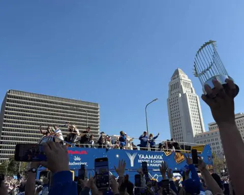 ‘We earned it,’ Dodgers fan says as thousands flock to parade in downtown L.A.