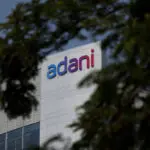 Major Adani investor GQG shares fall 13% after analyst downgrade