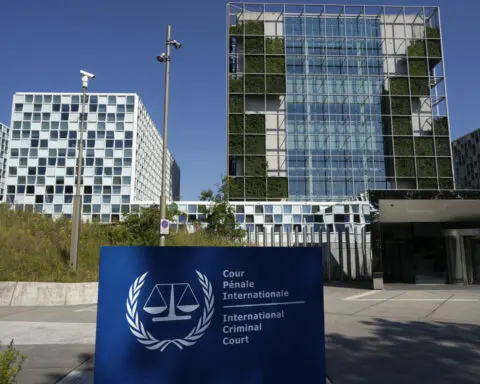 The International Criminal Court's chief lashes out at threats from Russia and a US senator