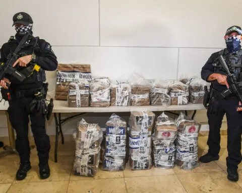 Australian police arrest 13 people and seize a record 2.3 tons of cocaine from a fishing boat