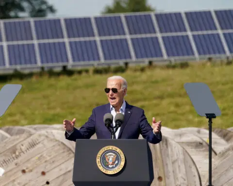 Biden pushes out over $100 billion in clean energy grants as term winds down