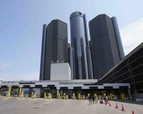 Losses in China lead to $5 billion charge for General Motors as it cuts the value of its assets
