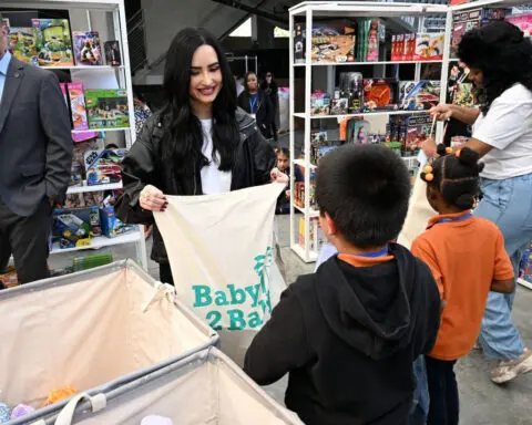 A heart-warming scene as celebrities help Christmas come early for children in South Los Angeles