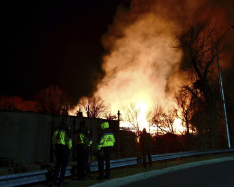 Wind-driven brushfire at Baltimore wood recycling yard closes expressway, light rail, schools