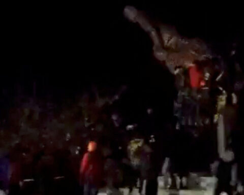 Syrian protesters topple statue of Syrian president's father south of Damascus city, residents and activists say