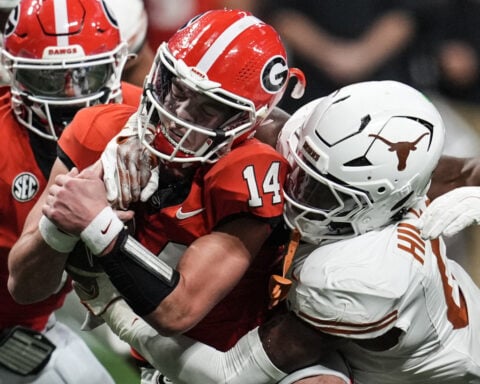 Georgia QB Carson Beck returns from hand injury for final snap in SEC championship OT win over Texas