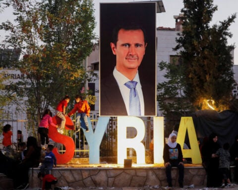 Whereabouts of Syria's Assad unknown; army officers say he boarded flight