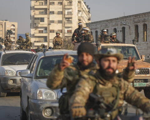 Syria latest: Syrians celebrate in the streets as Russian media says Assad has arrived in Moscow